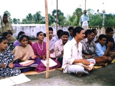 Group of visually impaired people at outdoor church worship meeting
